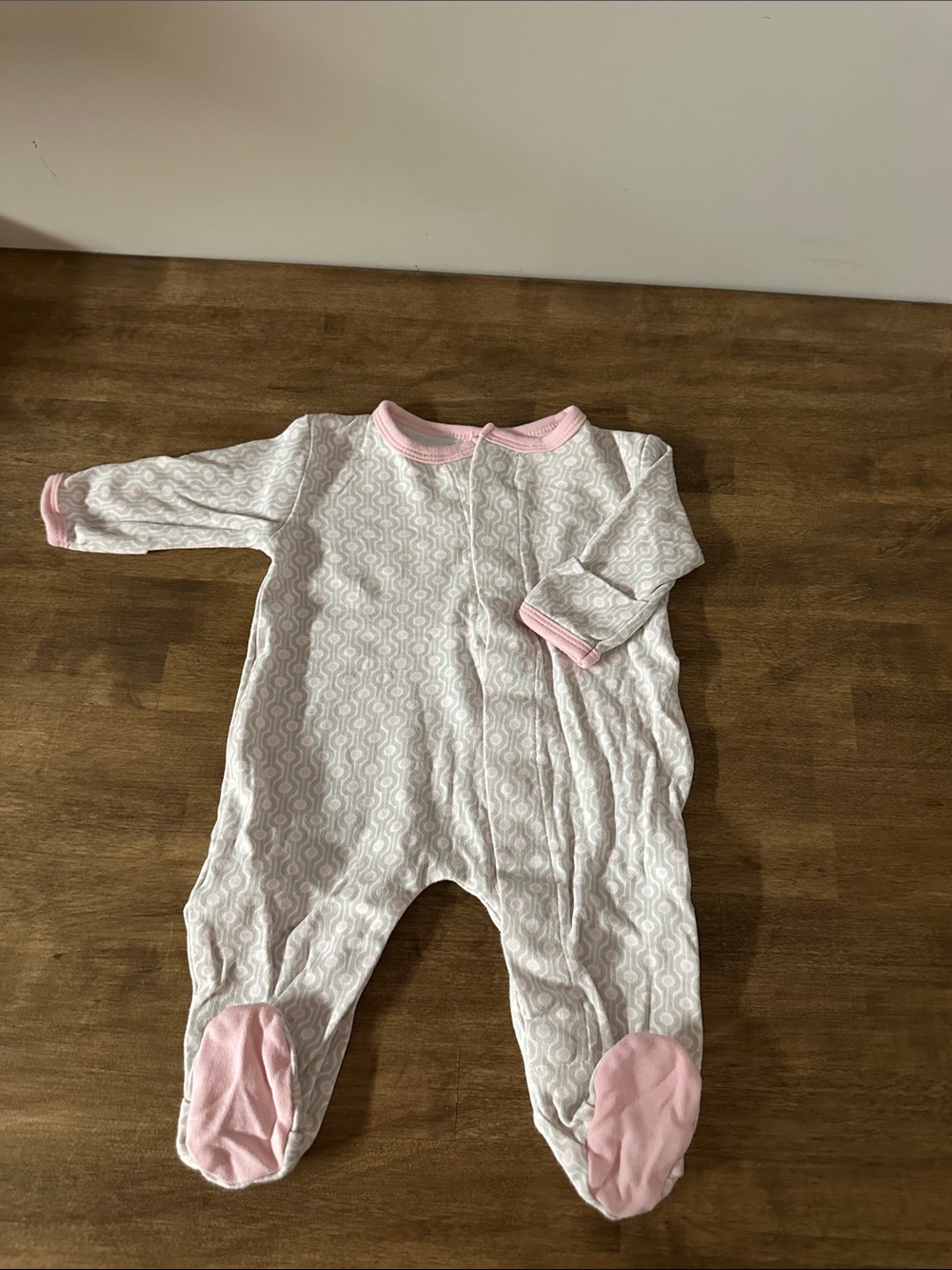 Magnificent Baby White Footed One-Piece with Pink Trim